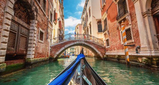 View from gondola during the ride through the canals in Venice