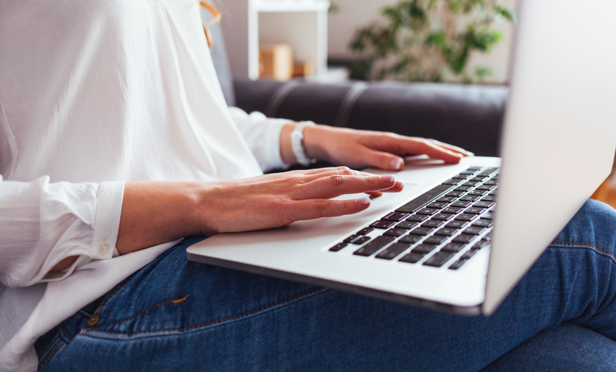 Woman at home using laptop
