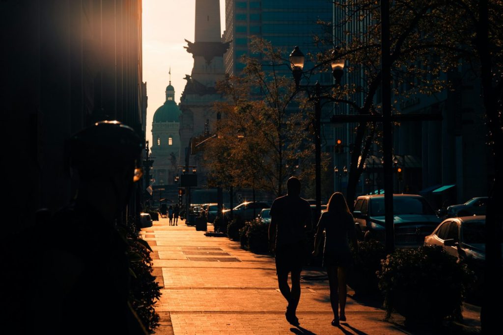 An Indianapolis street at sunset with light angling down a laneway