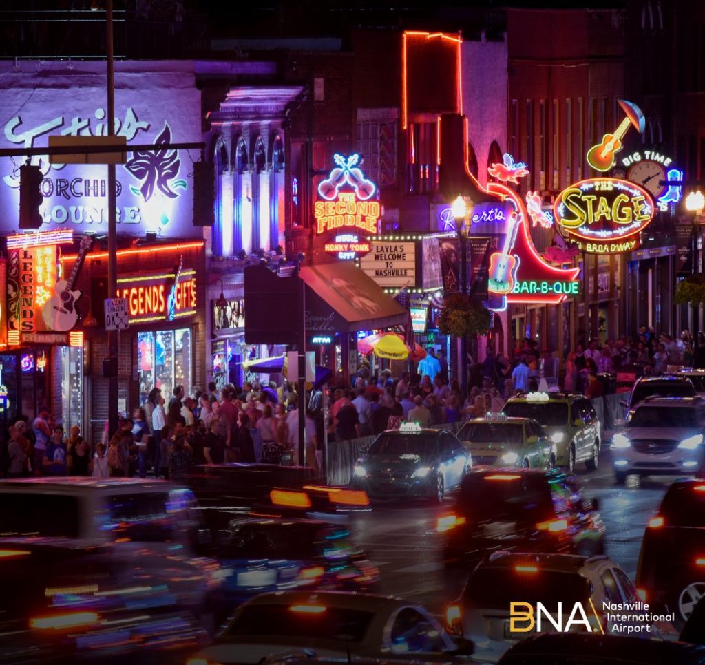 Neon signs and vibrant lights of an energetic city district at night