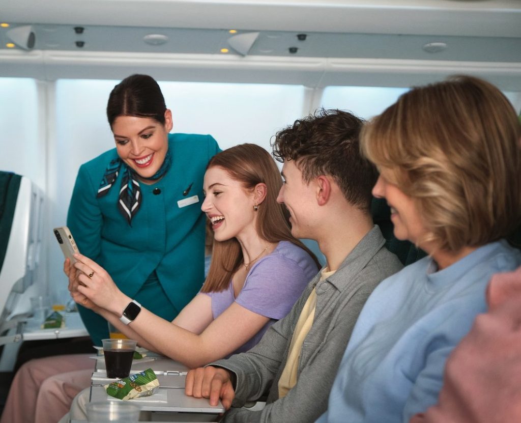 Cabin crew member interacting with family on board a flight