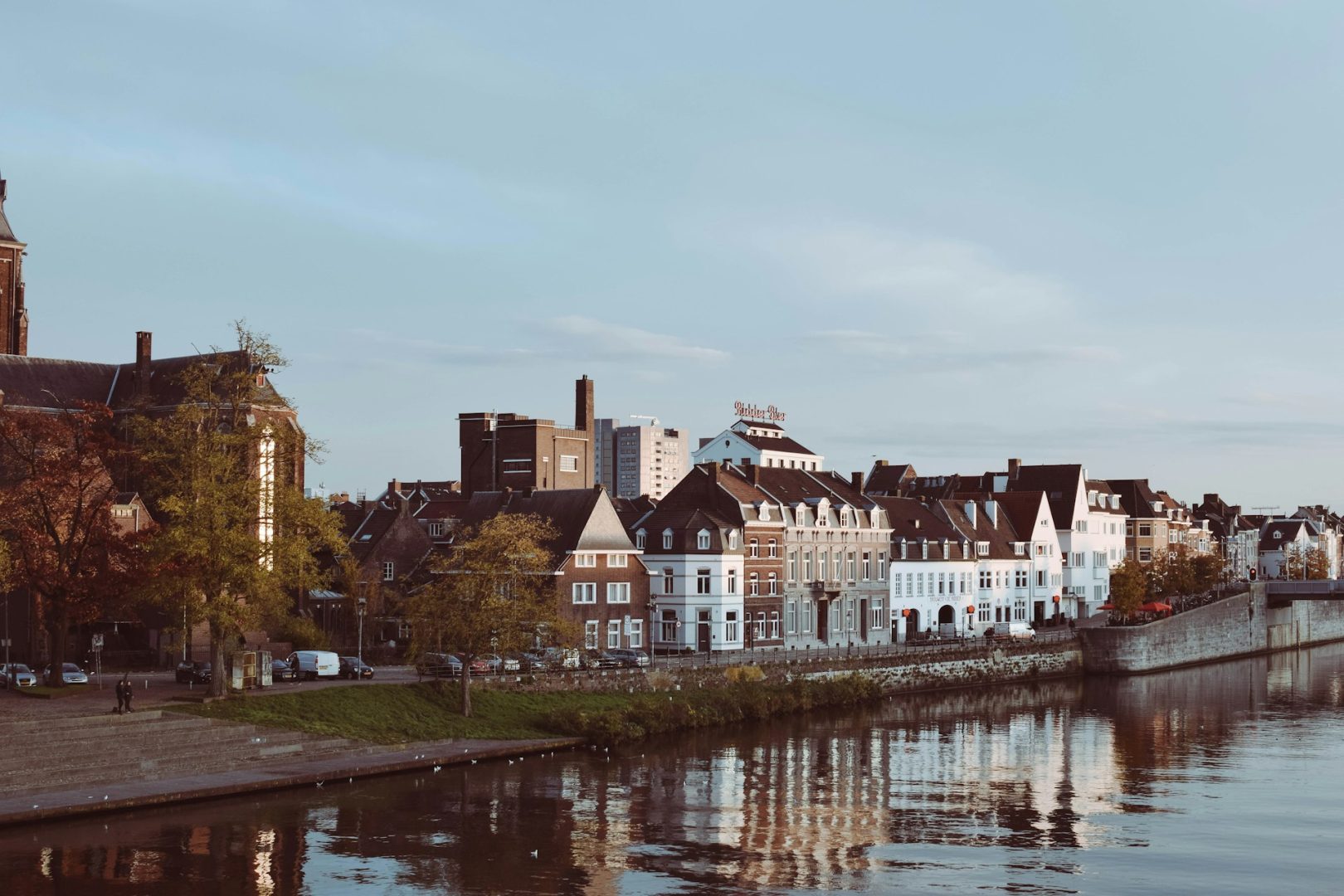Row of houses, river and sky in Maastricht