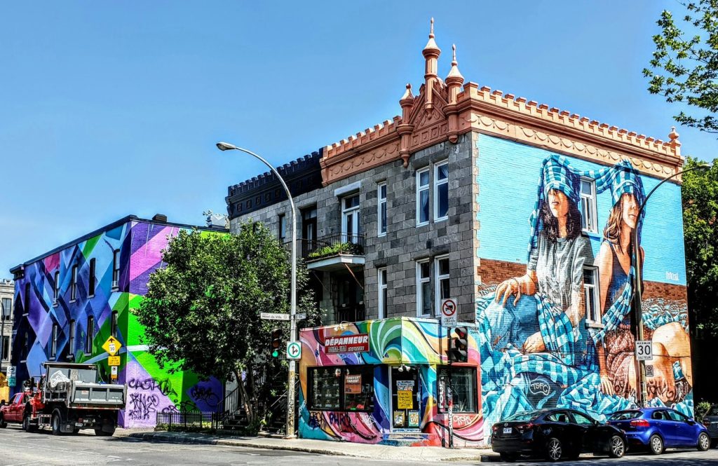 City street corner with colourful mural on a building