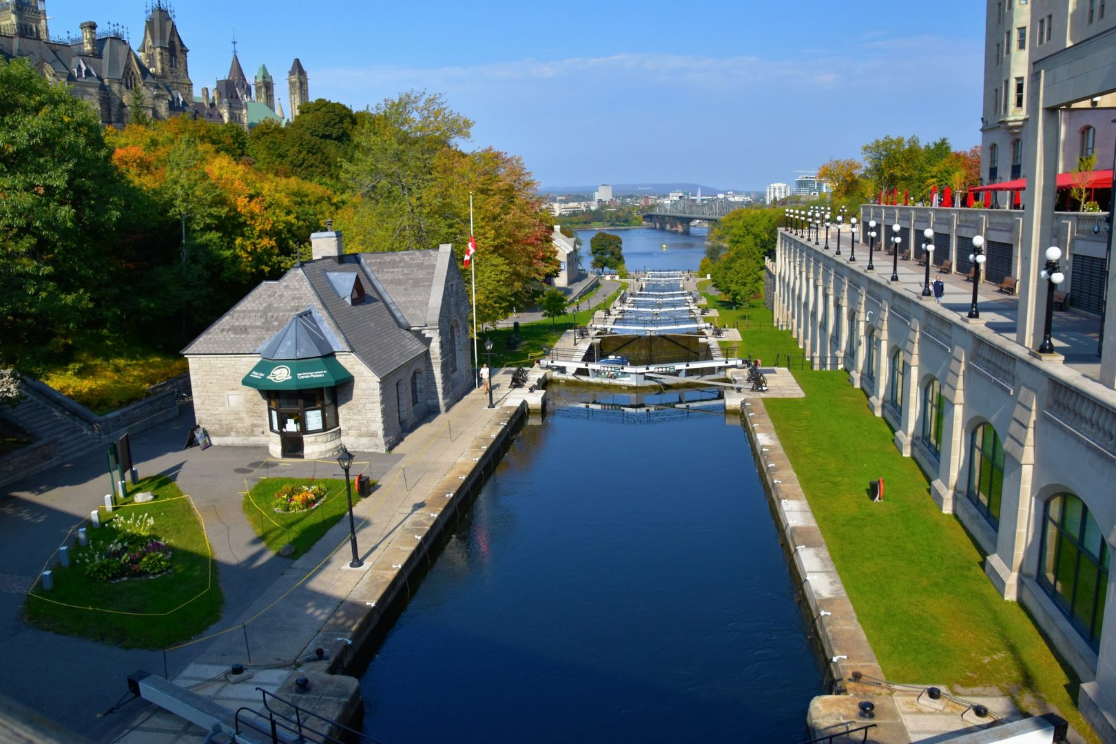 View of a canal with buildings, blue sky and water