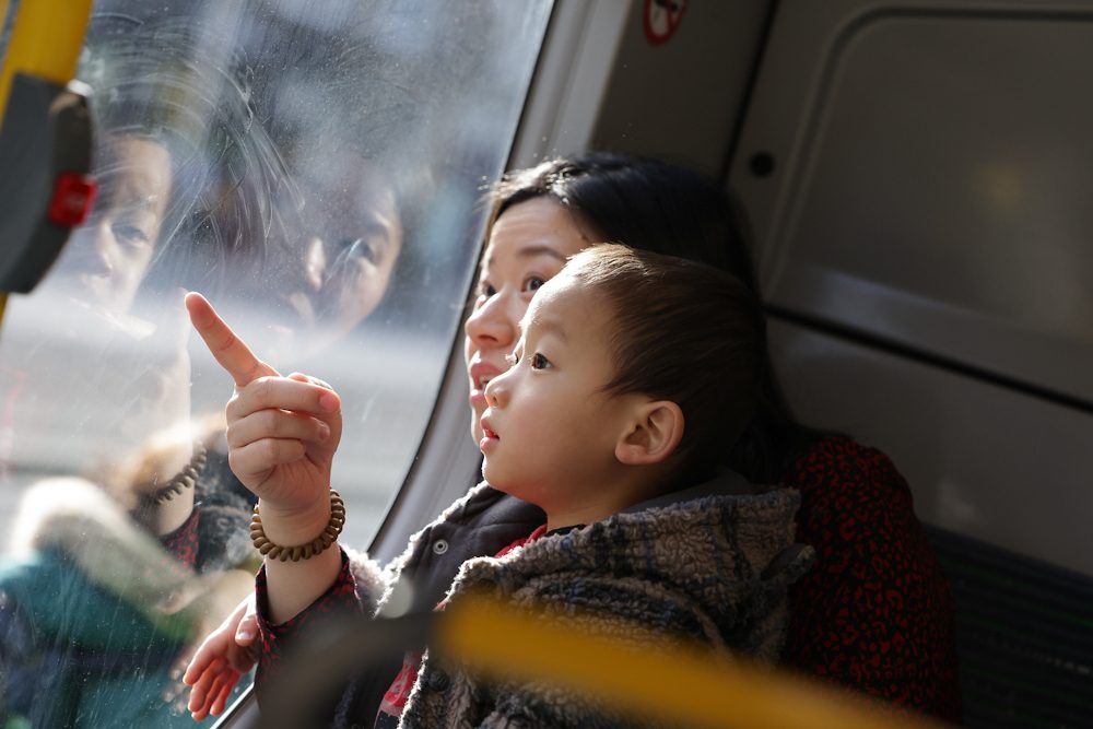 Mother and child looking out a window on Dublin Bus