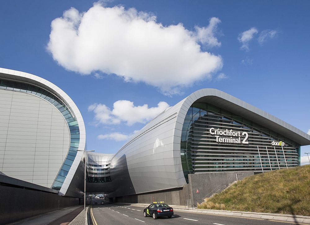 Taxi driving into Dublin Airport Terminal 2 on a sunny day