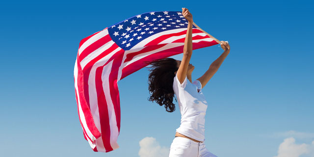 Woman holding Star Spangled Banner
