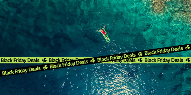 woman on green inflatable lilo at sea