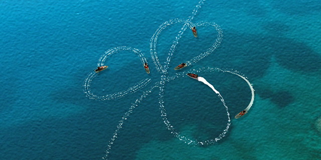 Jetskis making shamrocks in the sea