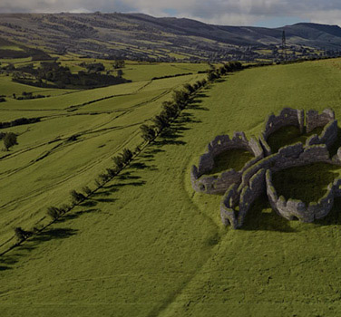 Fictional shamrock shaped hedge castle in a Scottish field