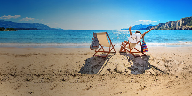 Woman on deckchair at beach