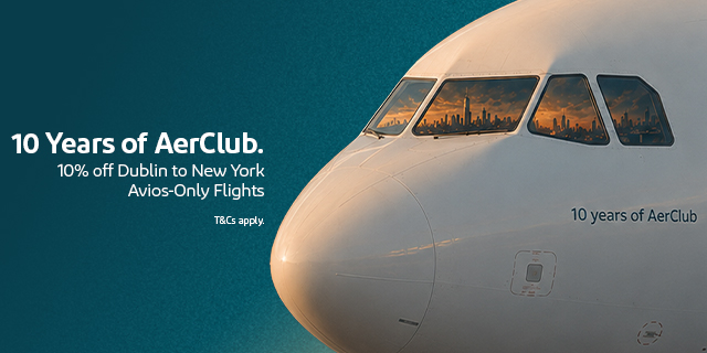 A330 aircraft nose with NYC reflected in window on a teal background