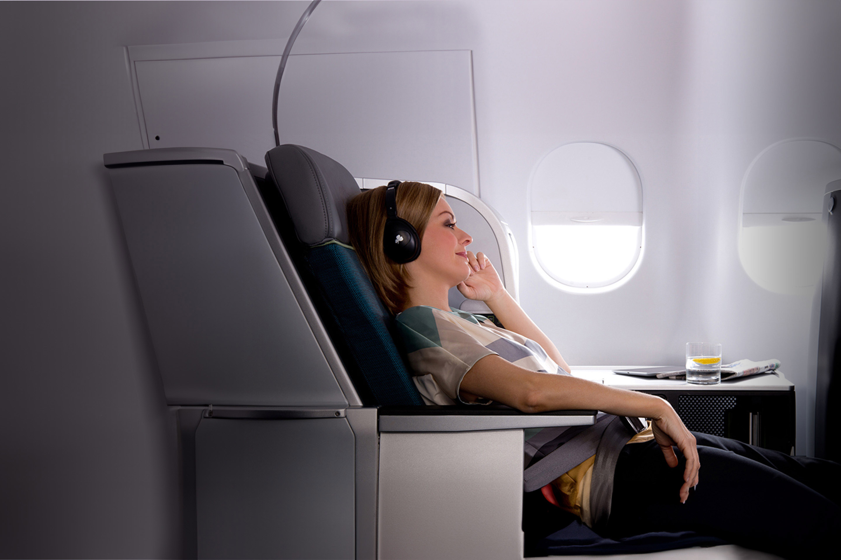 Woman relaxing in the Business Class cabin