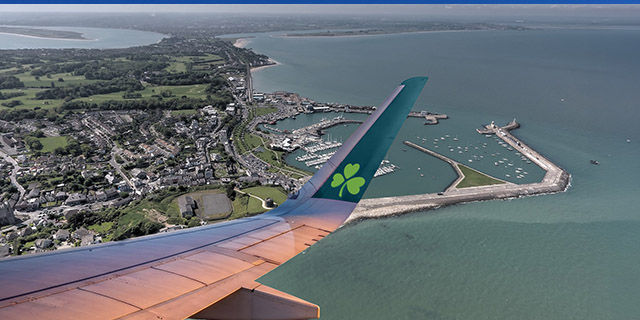View over Howth in Dublin with Aer Lingus wingtip in the foreground