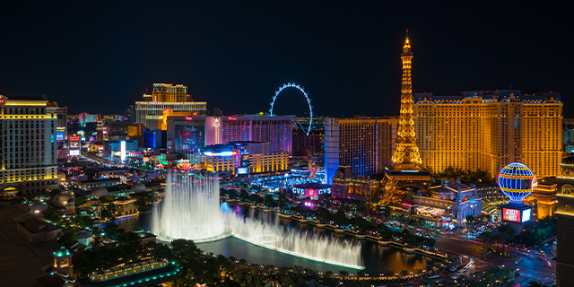 Aerial image of Las Vegas Boulevard at night with Bellagio fountain and Paris hotel